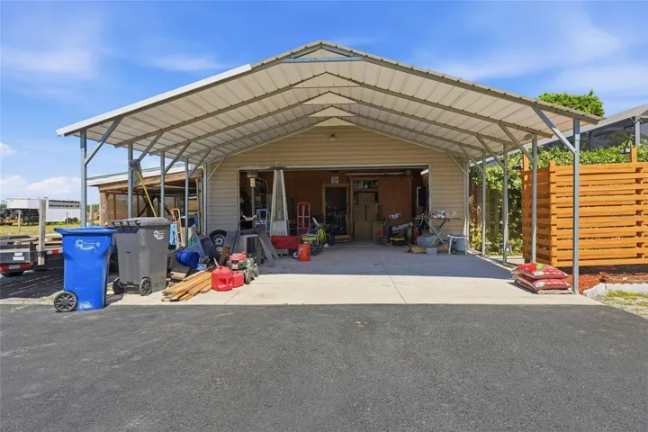 car port for off one of the garages offering covered parking for additional two vehicles