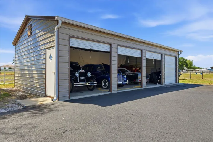 24.4 x 40.2 four bay garage - Multiple garage and storage spaces ideal for equipment, RVs, boats, or workshop use