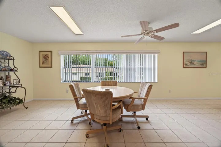 Second family room stretches the entire length the the home giving room for game tables, a home office or crafting and hobby area. Lots in in ceiling lights and 2 ceiling fans.