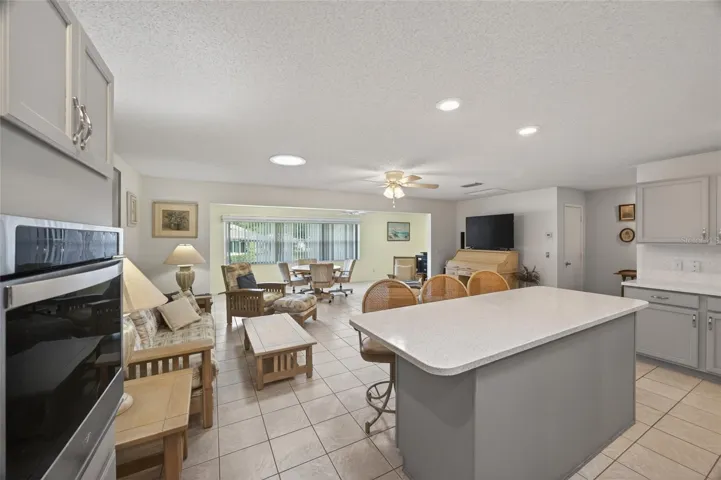 Combined kitchen and first family room provides great space for living and entertaining plus room for a dining table.