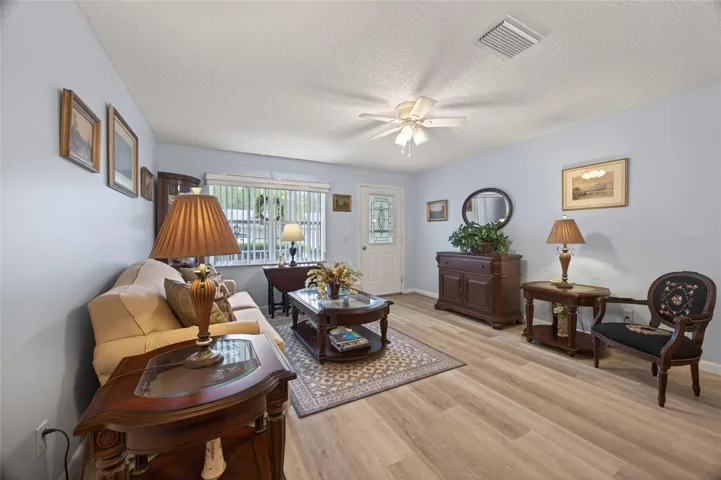 Plenty of electrical outlets, vertical window blinds and luxury vinyl planking.