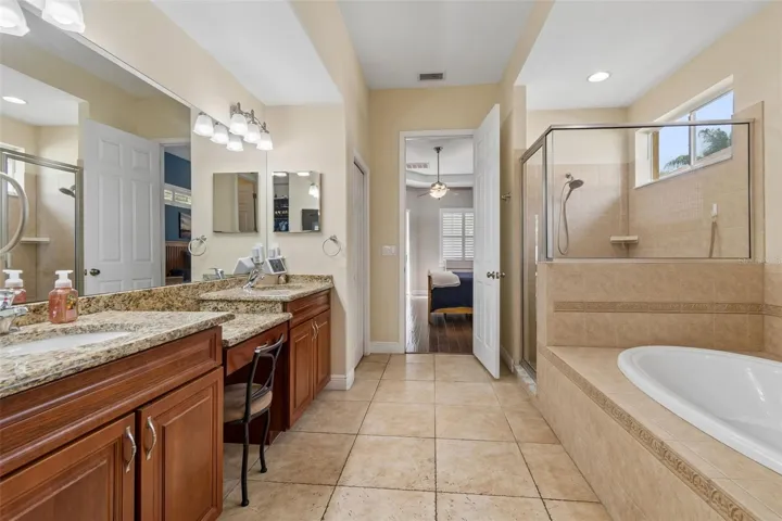 2 Linen closets, generous walk-in closet, water closet, separate tub and shower with double vanities...plenty of room for two to share!
