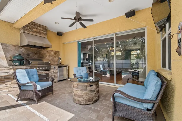 Seating area looks back into home....the three sliders recess all the way into wall, opening the indoors to the outdoors, expanding the area for family enjoyment or entertaining.