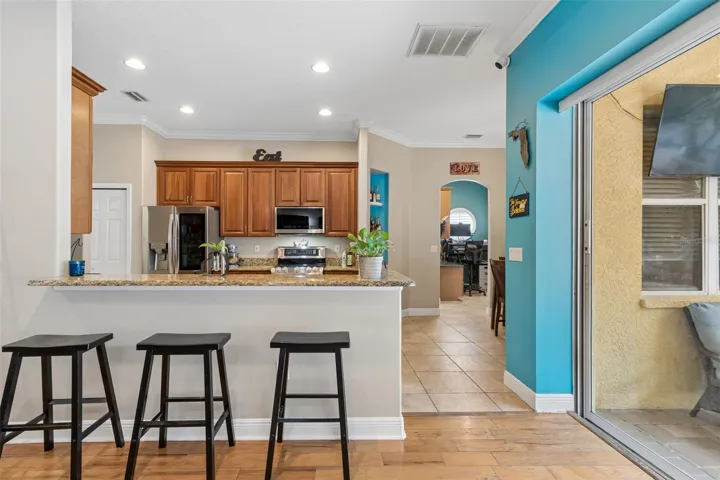 A glimpse towards the 2nd and 3rd bedrooms with an office/workspace between.