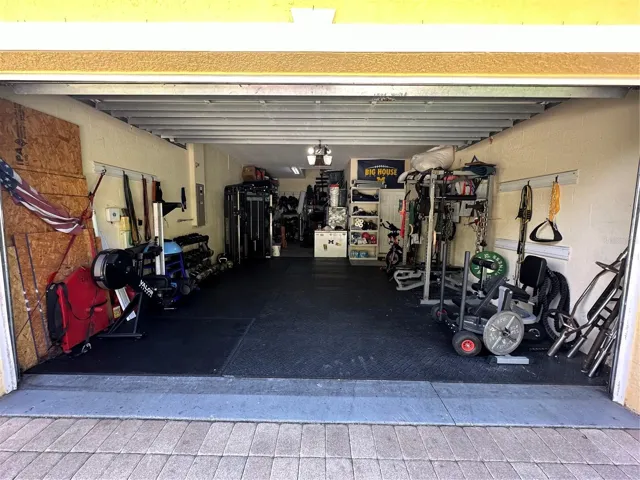 3-Car tandem garage, presently used as home gym.