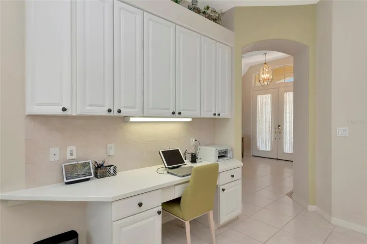Kitchen correspondence desk w/ cabinet storage.
