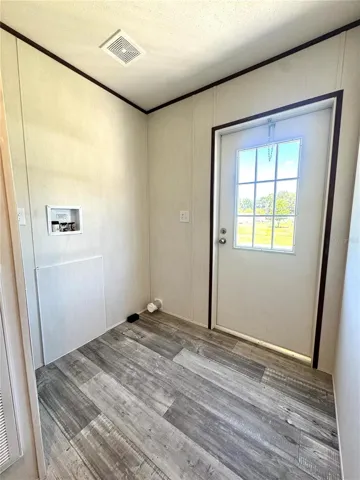 Laundry room leads to back yard