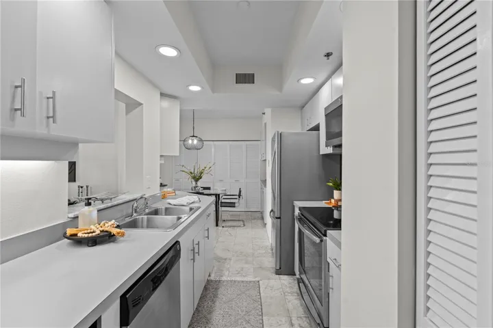 Light and bright kitchen with new lighting, fresh paint, new wine refrigerator