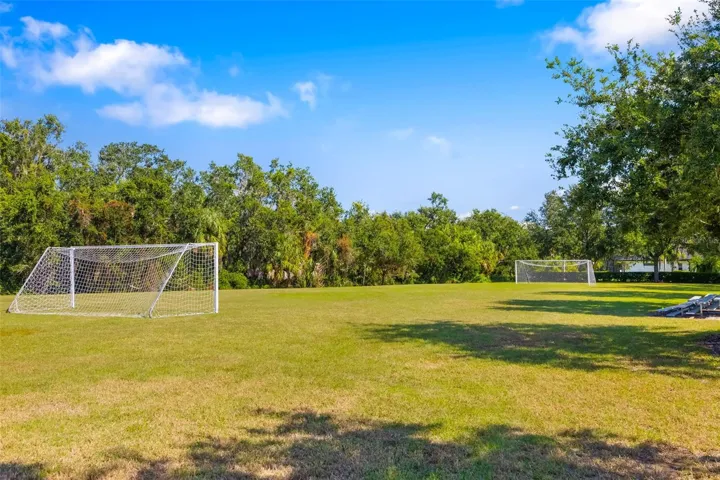 Open green space with soccer field—perfect for recreation, sports, and outdoor activities.