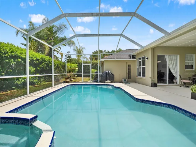 Generous pool layout with ample deck space for lounging, all within a screened enclosure that enhances comfort and usability.