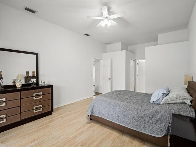 Expansive primary suite with clean lines, neutral tones, and easy access to the ensuite bath, creating a comfortable and functional layout.