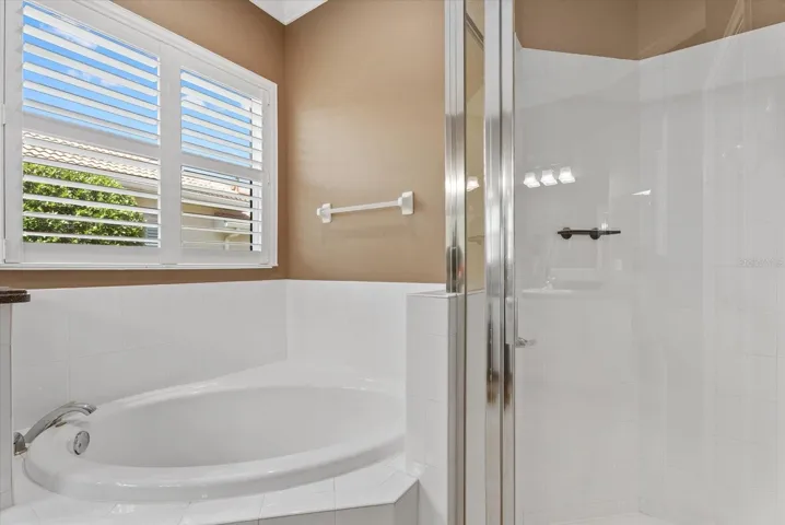 Primary bathroom with garden tub and walk-in shower