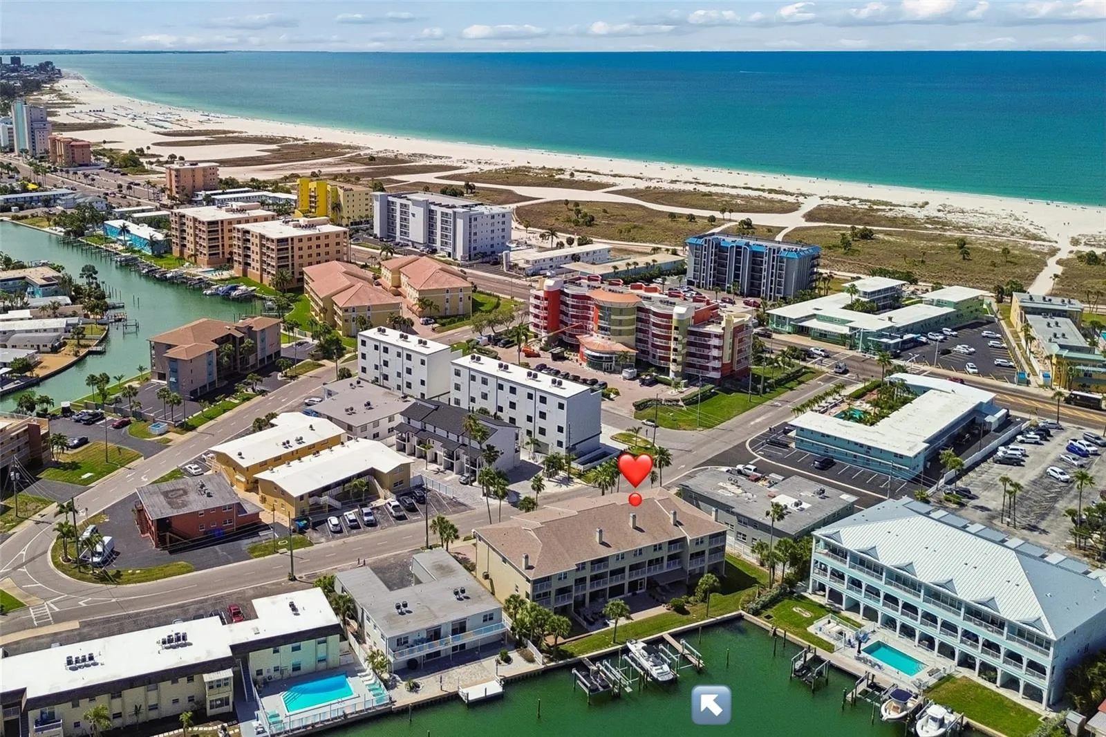 Manicured waterfront townhouse community one block from the beach. Next to a beautiful wide clear water beach.