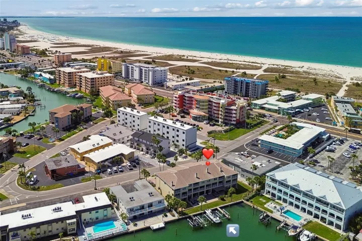 Manicured waterfront townhouse community one block from the beach. Next to a beautiful wide clear water beach.