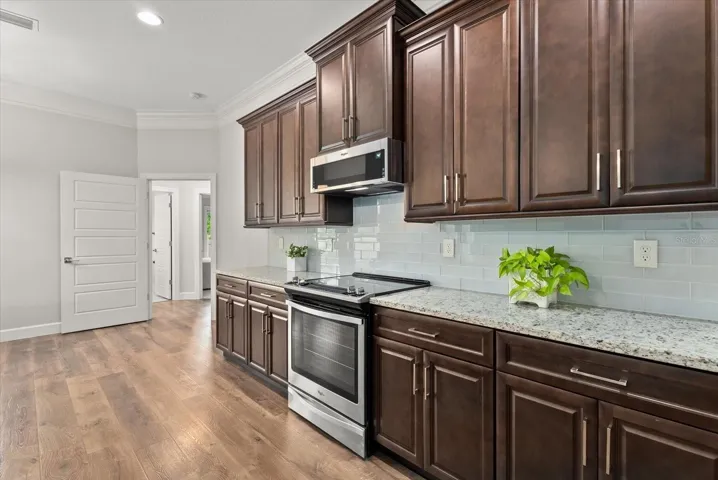Kitchen with Granite Countertops and Stainless Steel appliances