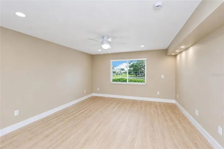 Primary bedroom with view to water