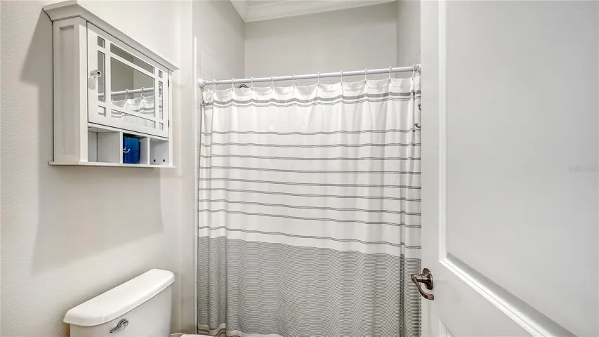 Jack and Jill shower/tub combo with toilet