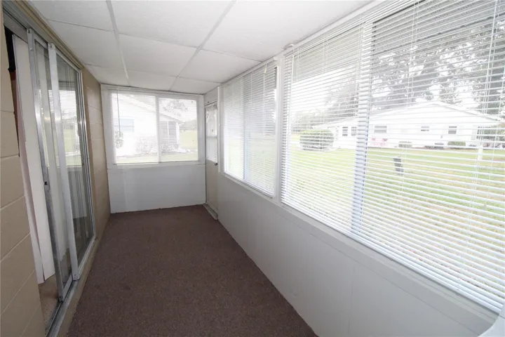 Enclosed lanai in the back of the home, window blinds allow you to let in just the right amount of light.