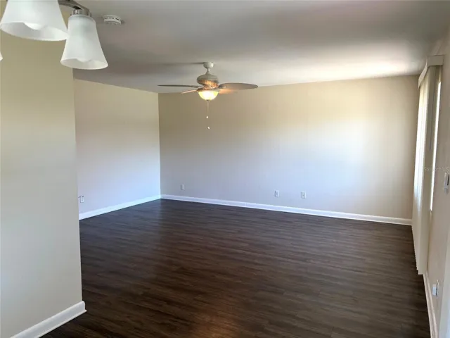 From dining room facing the living room, this open floor plan is spacious with good natural light.