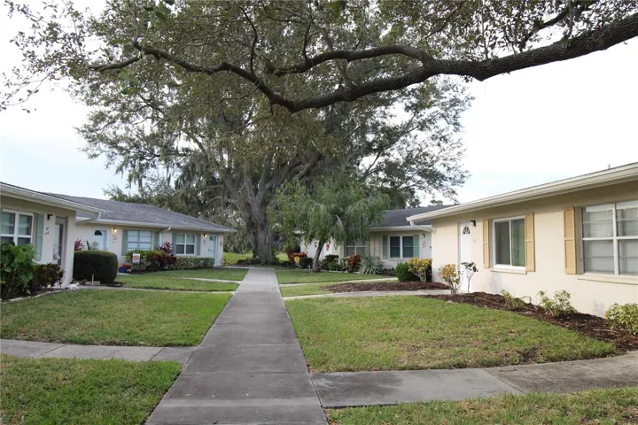 Lovely courtyard, sidewalk from assigned parking leads to front entrance.