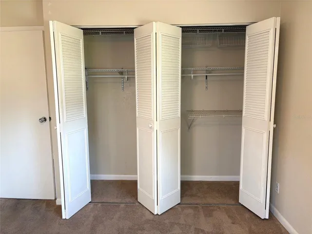 Guest bedroom wall closet with plenty of storage space.
