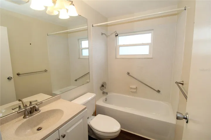 Guest Bathroom, bright and pretty with tub and shower combo.