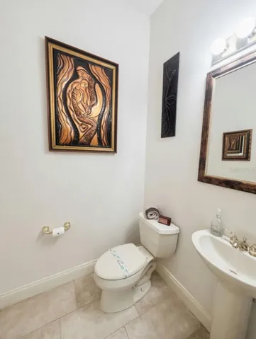 Half Bath by Garage and Laundry