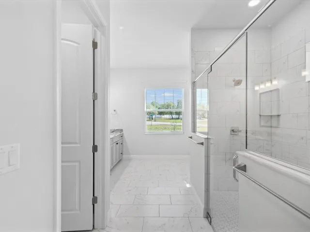 Relax and unwind in the spa-like primary bathroom at 11981 Robina Road, Weeki Wachee, FL.