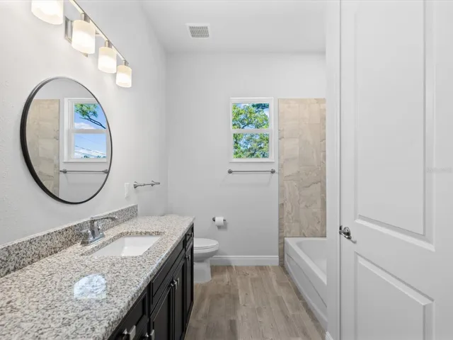 Bathroom 2 offers a stunning shower along with a beautifully appointed tub