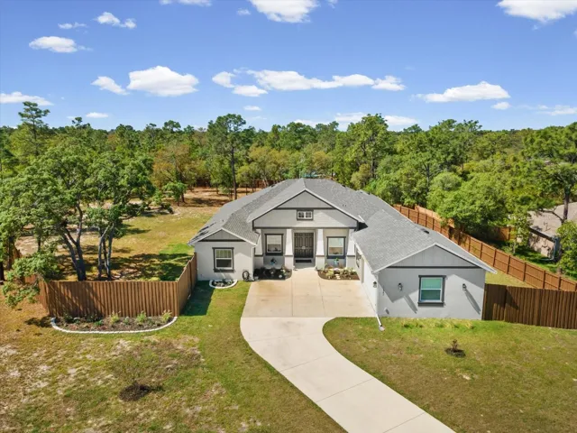 New construction luxury home, custom built home for sale, move in ready luxury home, 5 bedroom home with acreage, Florida luxury real estate, Brooksville FL homes for sale, Spring Hill FL luxury home, Hernando County new construction, open concept luxury home, coffered ceilings, oversized sliding glass doors, eat in kitchen with granite island, Viking propane cooktop, double oven kitchen, oversized walk in pantry, climate controlled garage, in law suite with ensuite bath, zero entry walk in shower, spa like primary bathroom, home on 1.27 acres, fully fenced property, private acreage home, covered outdoor patio, outdoor kitchen ready, room for pool and spa, generator ready home, buried propane tank, luxury entertainer’s home, high end finishes throughout, multi generational living, private retreat home, custom lifestyle home,