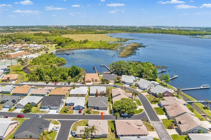 FRONT AERIAL VIEW OF HOME IN COMMUNITY