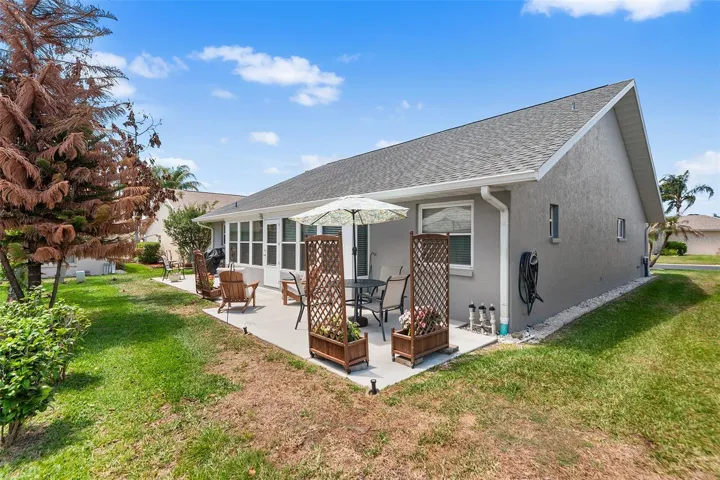 VIEW OF BACKYARD, PATIO AREA AND HOME