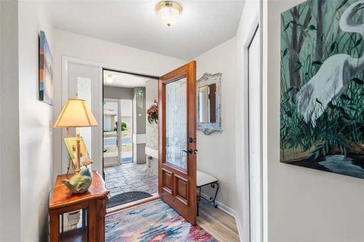 VIEW TOWARDS FOYER & SCREENED FRONT ENTRY