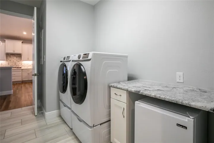 Large laundry with folding table - closet opposite