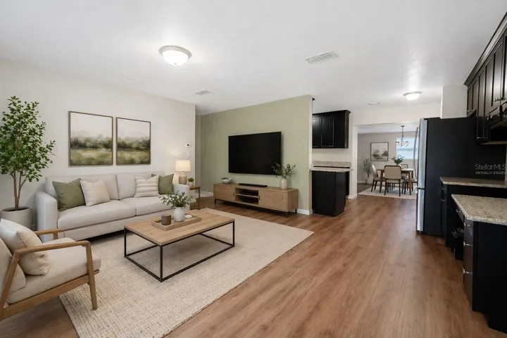 VIRTUALLY STAGED/PAINTED LIVING ROOM WITH KITCHEN & DINING/FLEX ROOM IN REAR