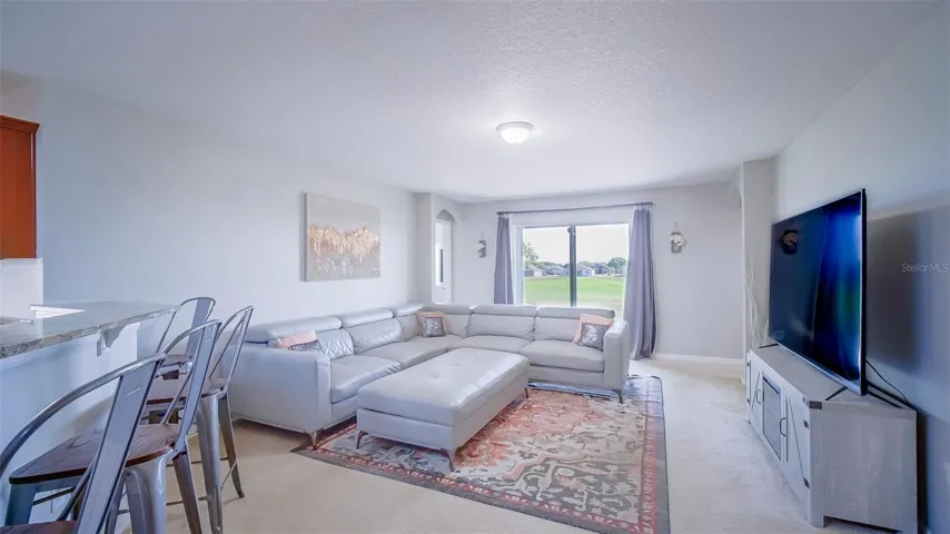 Before - Gathering area with carpets