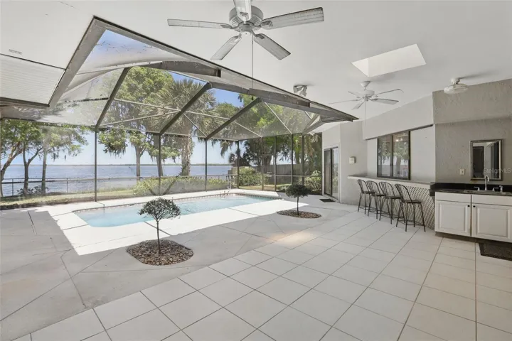 Bar by pool w/ the kitchen window that opens