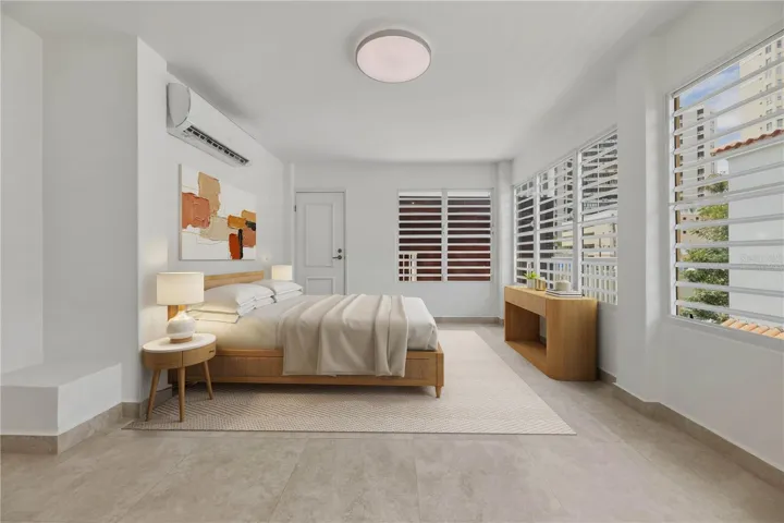 Primary Suite - This image has been virtually staged and does not reflect the current state of the property.