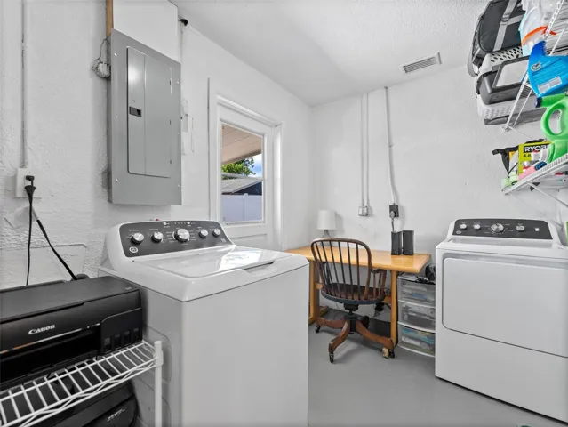 Large utility room with additional space for a desk and storage