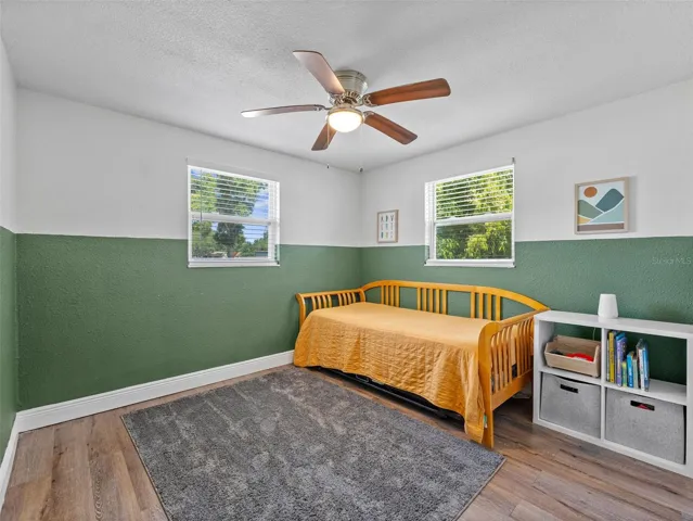 Bedroom 2 is spacious and clean with vinyl plank flooring