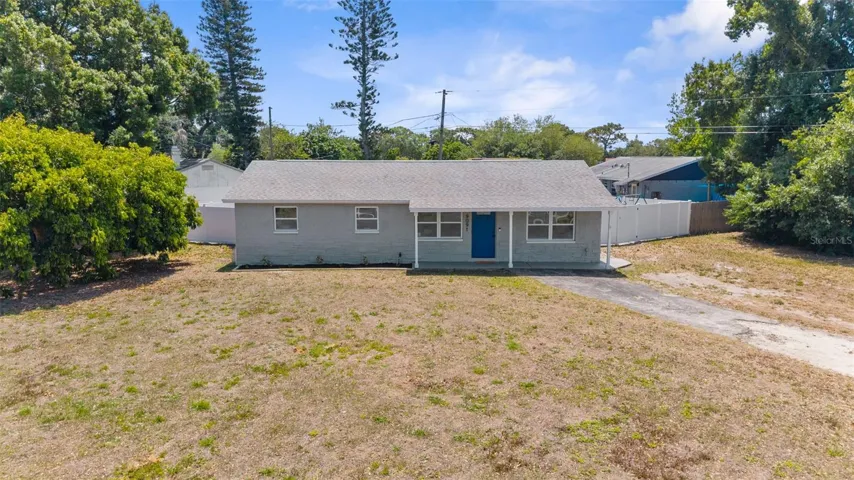 Drone shot of the front exterior of the home and property