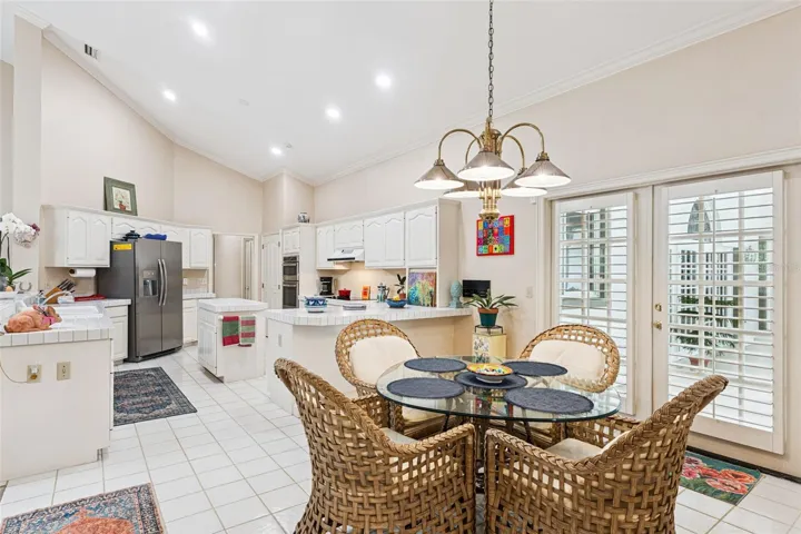Kitchen Nook area with Lanai Pool Access doors.