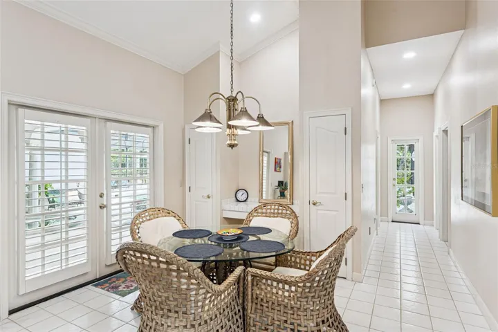 Kitchen Nook with storage closets, hallway leading to 2 Bedrooms and Full Polol Bath.