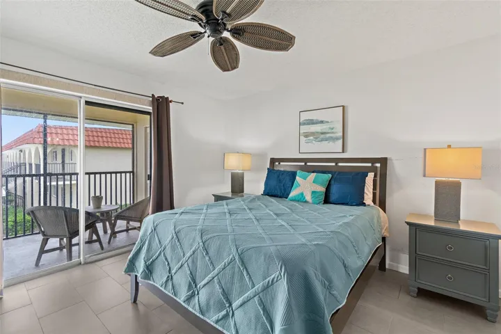 Primary bedroom with balcony access