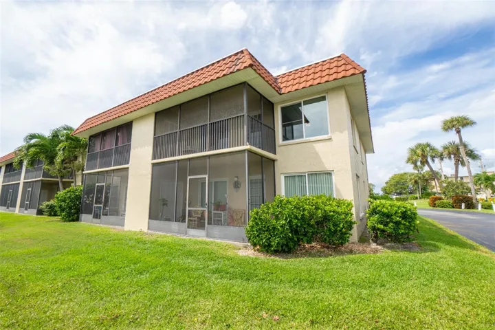 Building exterior, landscaped end view
