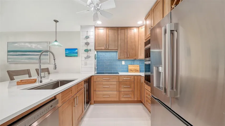 Beverage refrigerator and Quartz countertops.