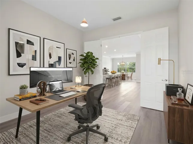 Ai Virtually staged den/office.