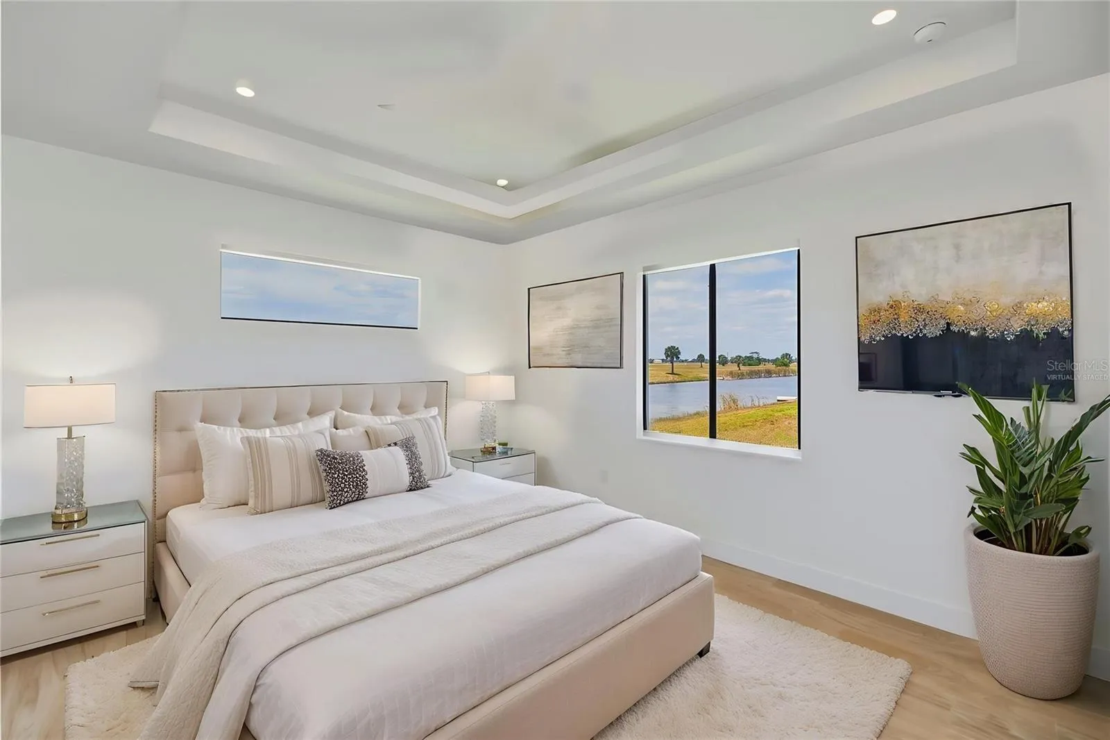 Virtually Staged 1st Floor Primary Suite with Tray Ceiling.