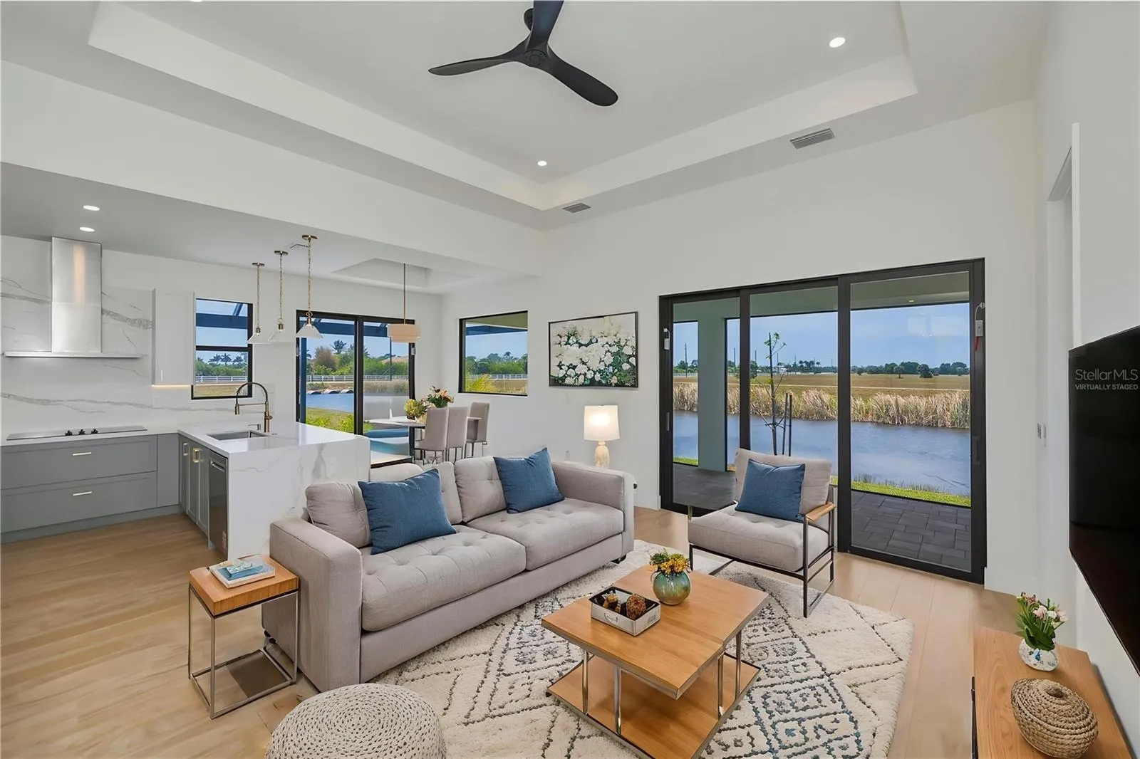 Virtually Staged Living Room with Waterfront Views.