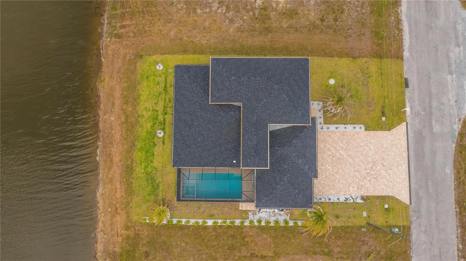 Pool, Paver Driveway and Waterfront Views,